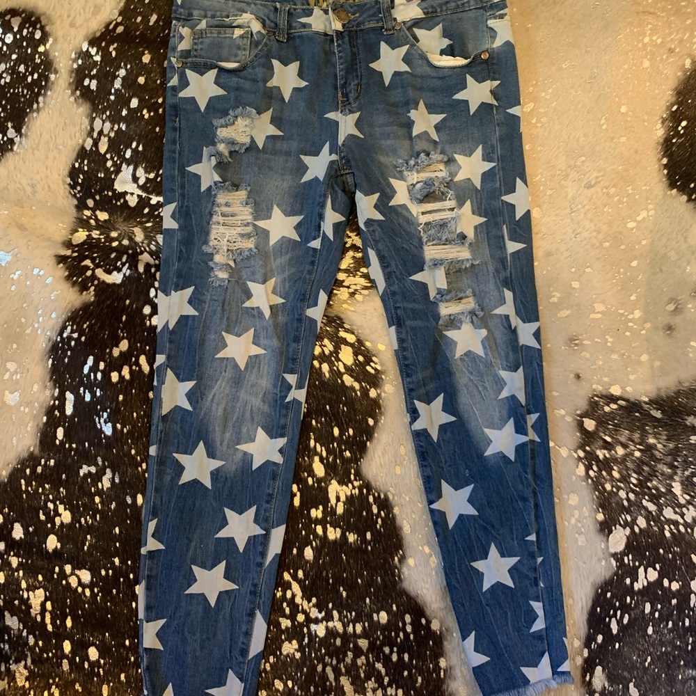 Star print ripped skinny jeans